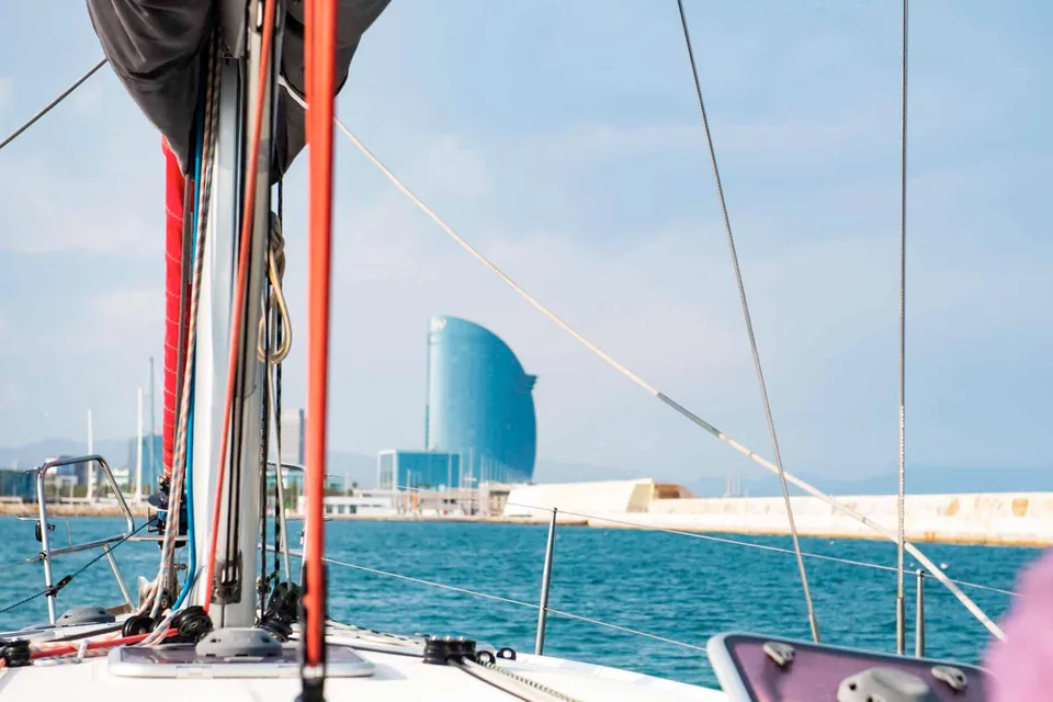 Sailboat deck in Barcelona with the sea and Hotel W in the background